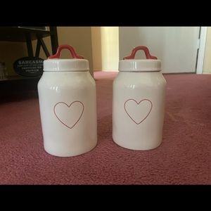 Rae Dunn heart canisters.